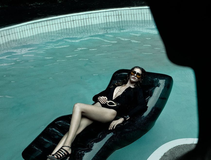 adult female person woman pool water swimming pool furniture glasses high heel